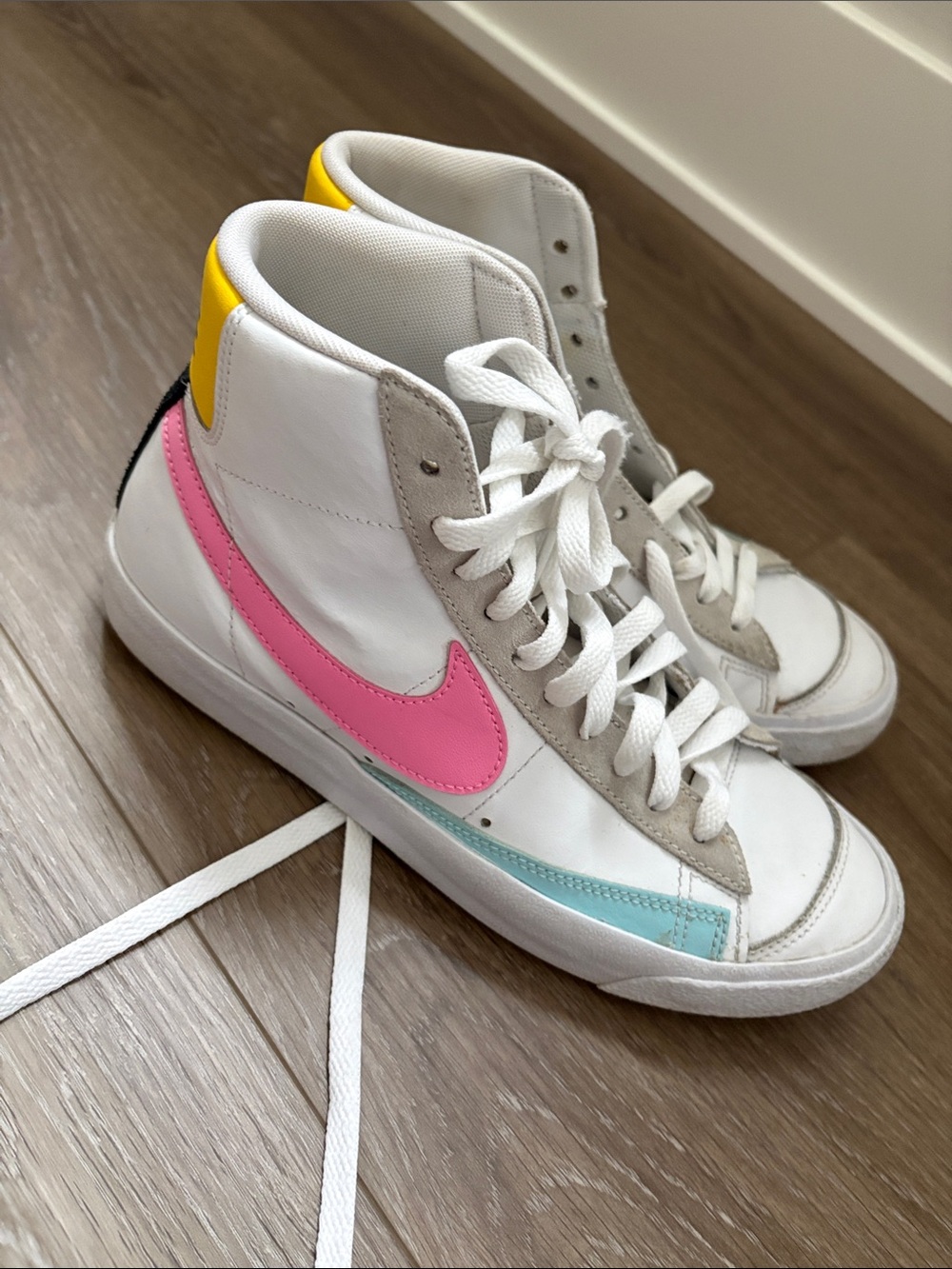Nike High-Top Sneakers in White with Pink Swoosh and Yellow Heel